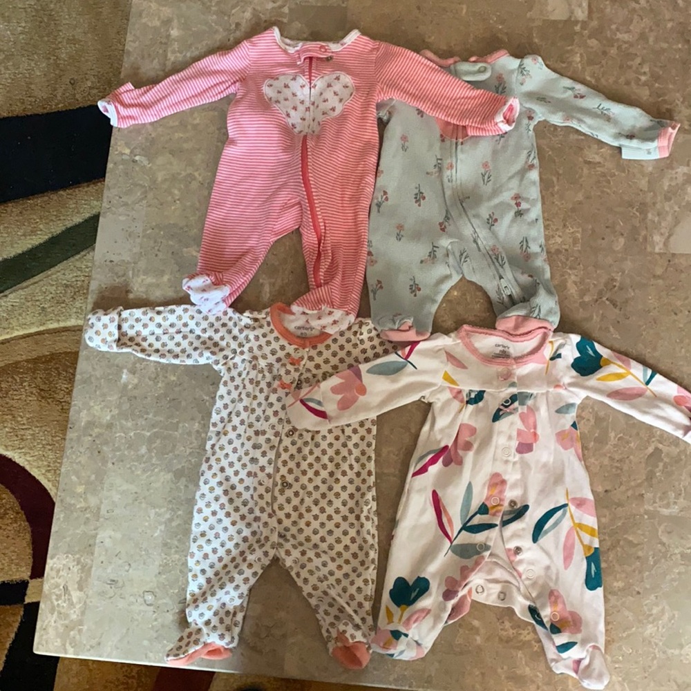 4 bundles of Carter’s Newborn footed pajamas